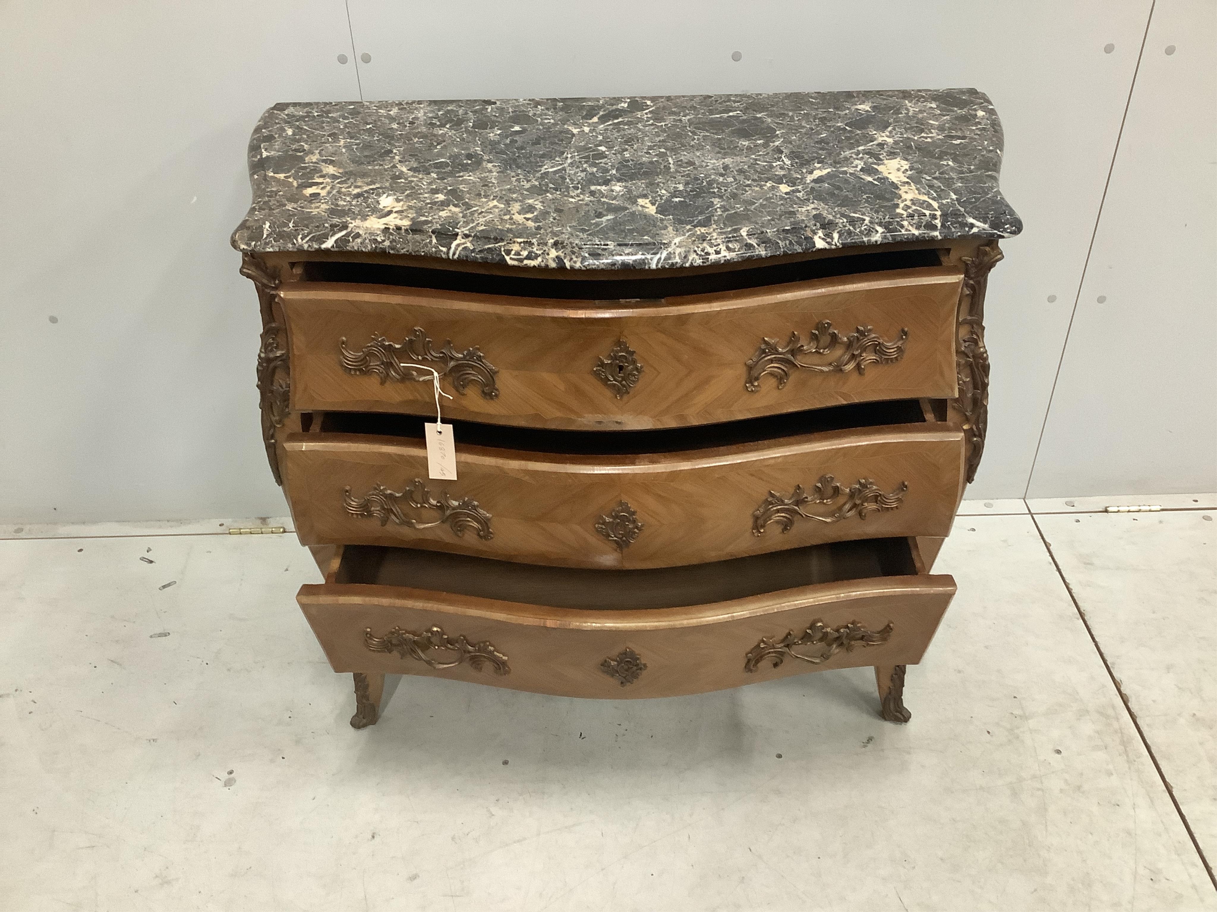 A Louis XV style gilt metal mounted marble top bombe commode, width 105cm, depth 49cm, height 89cm. Condition - fair